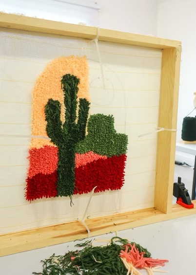 Friends enjoying tufting together in the studio